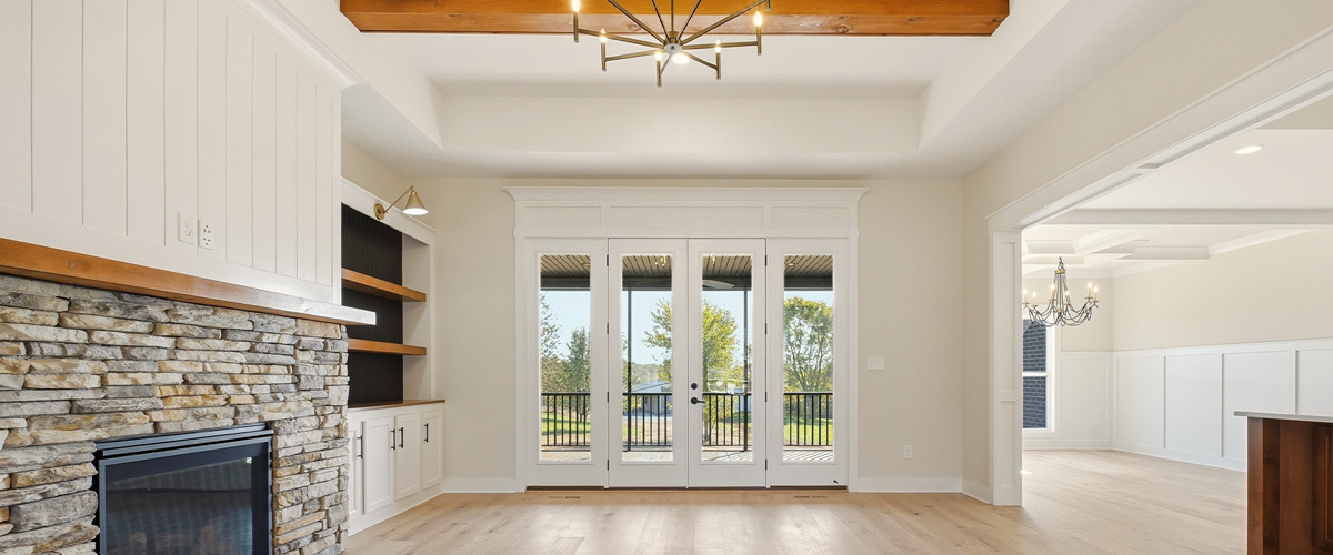 living room with stone fireplace