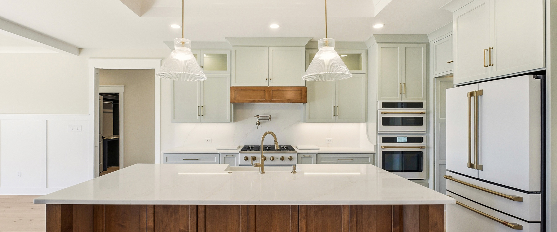 new construction kitchen with sea salt cabinets