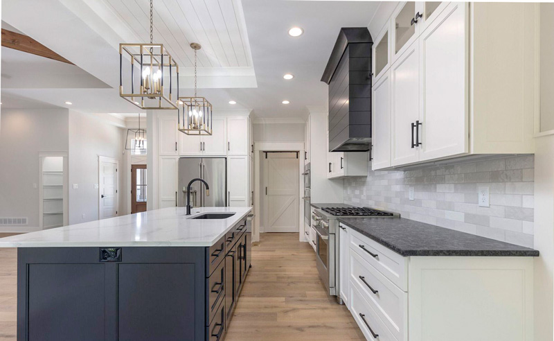 Gourmet with quartz counter tops contrast cabinets